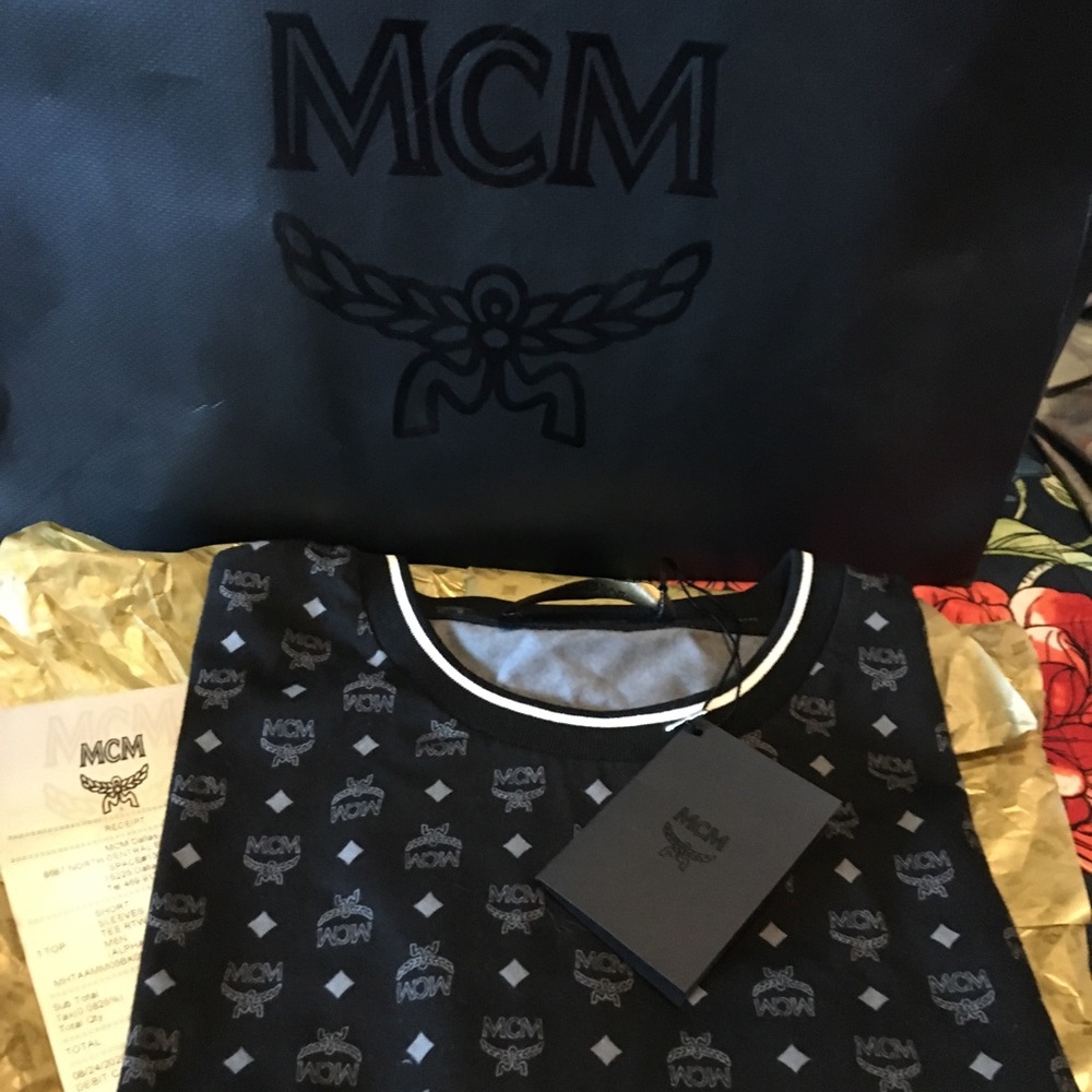 MCM black tee. NWT and original gift bag and packaging. Mens large (runs small).